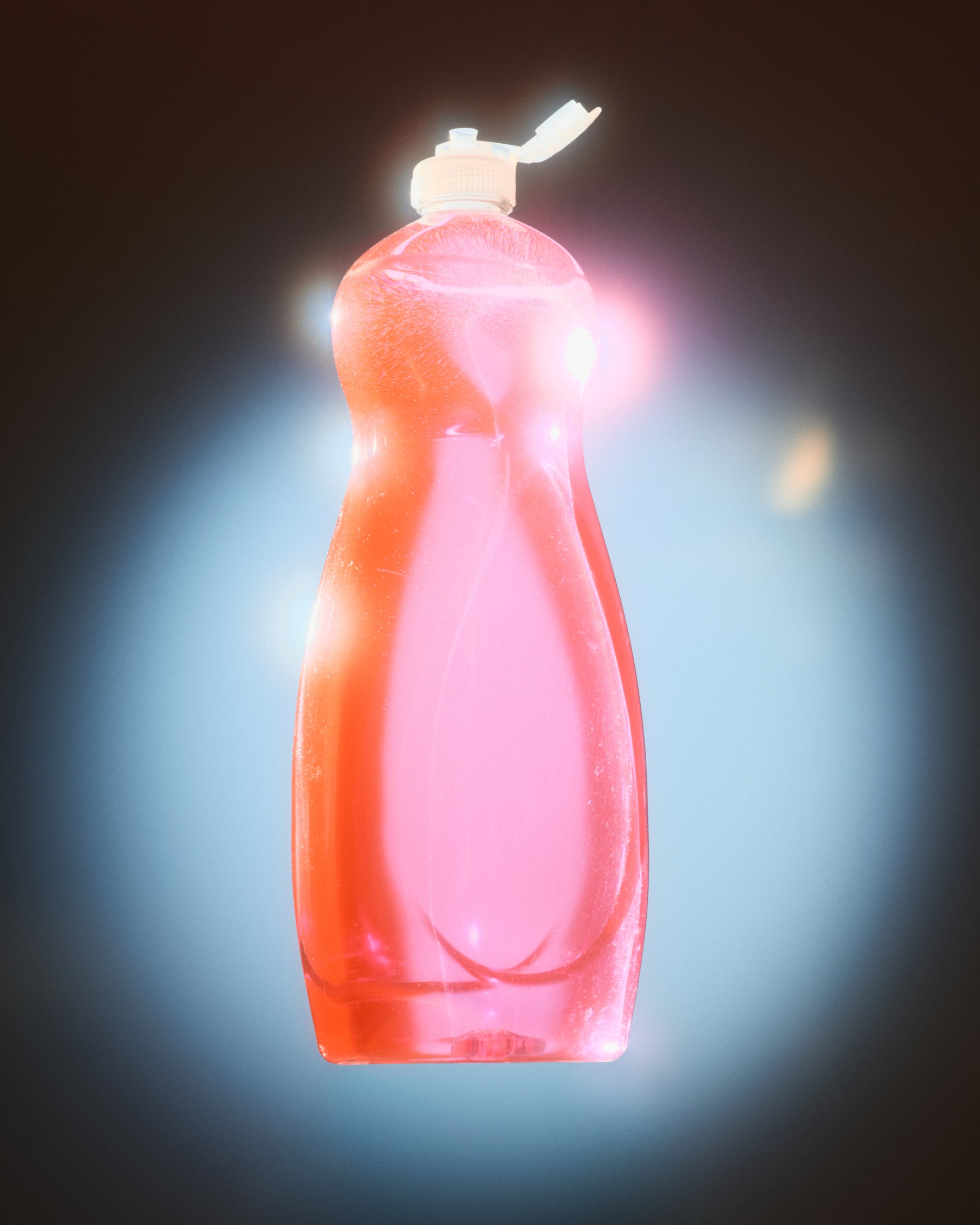 A translucent pink plastic bottle with a white flip-top cap, centered against a dark background with a bright blue-white glow around it.