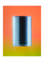 A metallic silver canister centered on a vibrant orange-to-yellow gradient background.